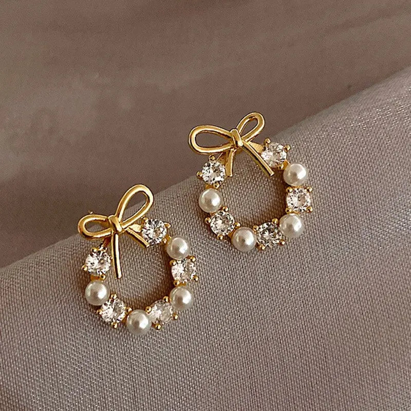 Minimalist Round Bow Knot Earrings for Women: Elegant, fashionable stud earrings featuring rhinestones and imitation pearls, perfect for parties and weddings.