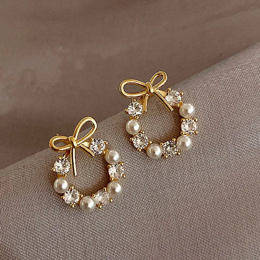 Minimalist Round Bow Knot Earrings for Women: Elegant, fashionable stud earrings featuring rhinestones and imitation pearls, perfect for parties and weddings.