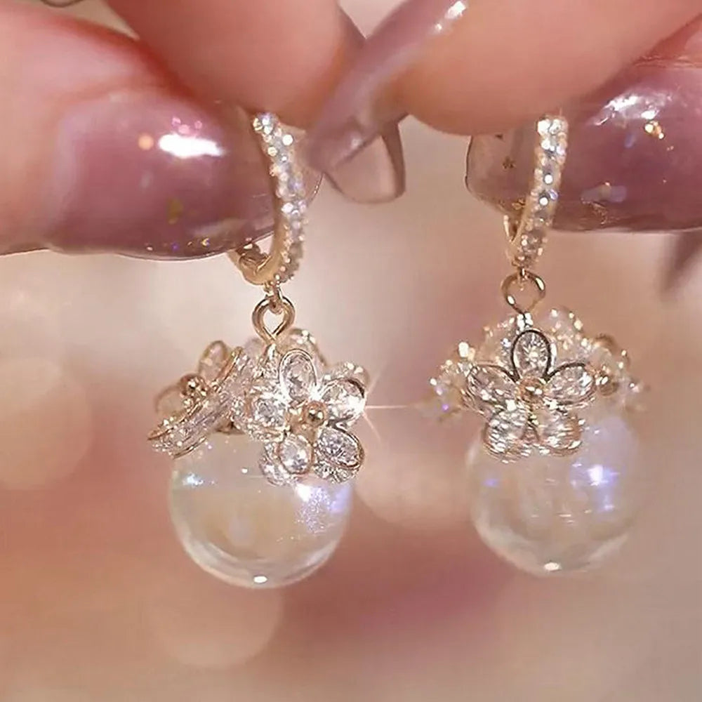 Simulation Pearl Long Earrings:
- Style: 2022 New Trend
- Design: Flower Rhinestone
- Type: Wedding Pendant Earrings